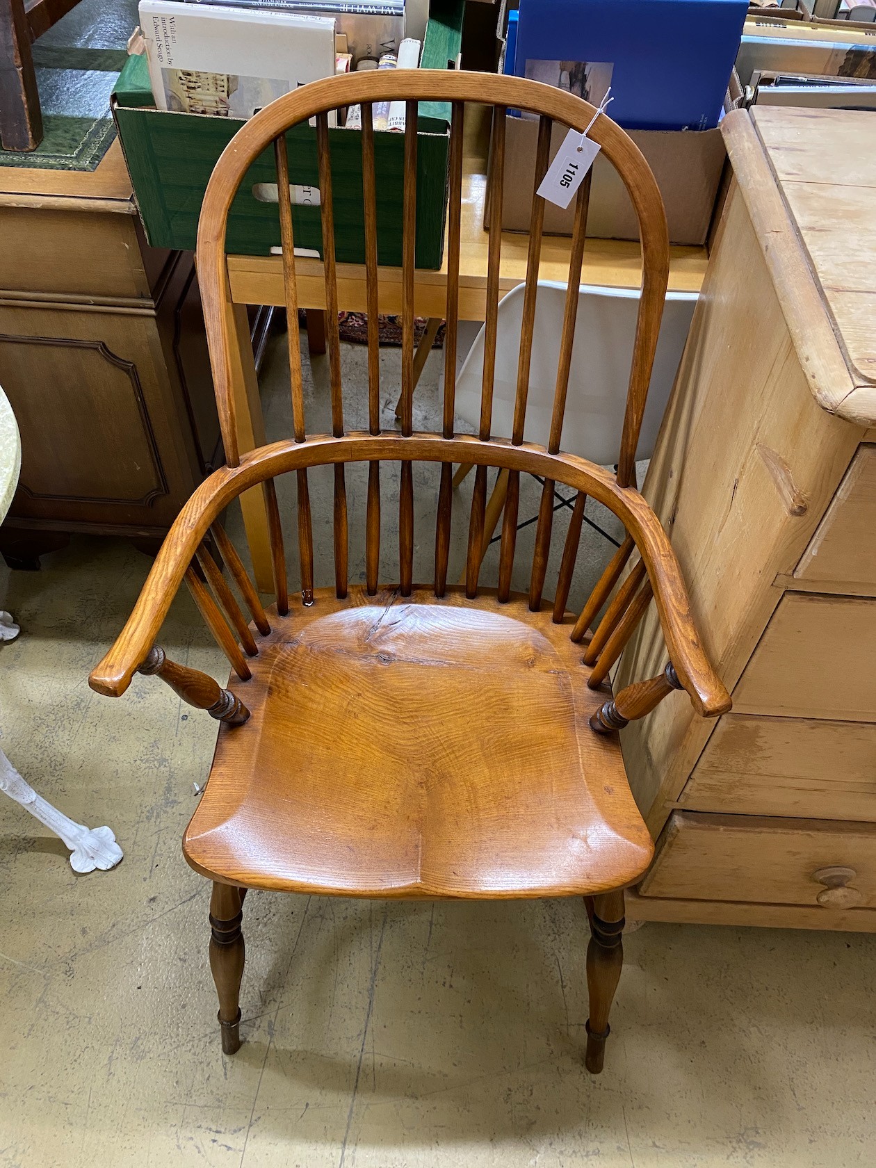 A Windsor elm and beech comb back elbow chair with crinoline stretcher, width 59cm, depth 44cm, height 106cm